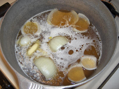 Brats simmering in beer