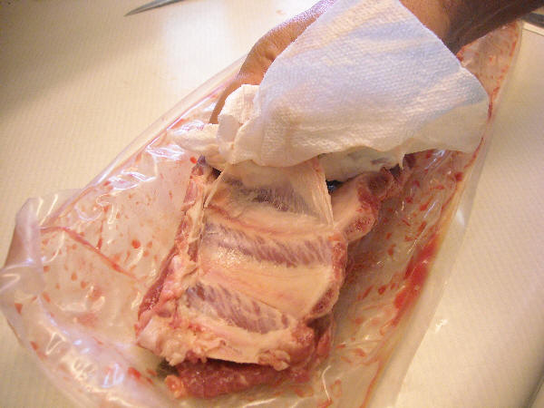 Using paper towel to grip the membrane