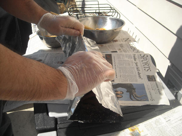 Sprinkling brown sugar on ribs